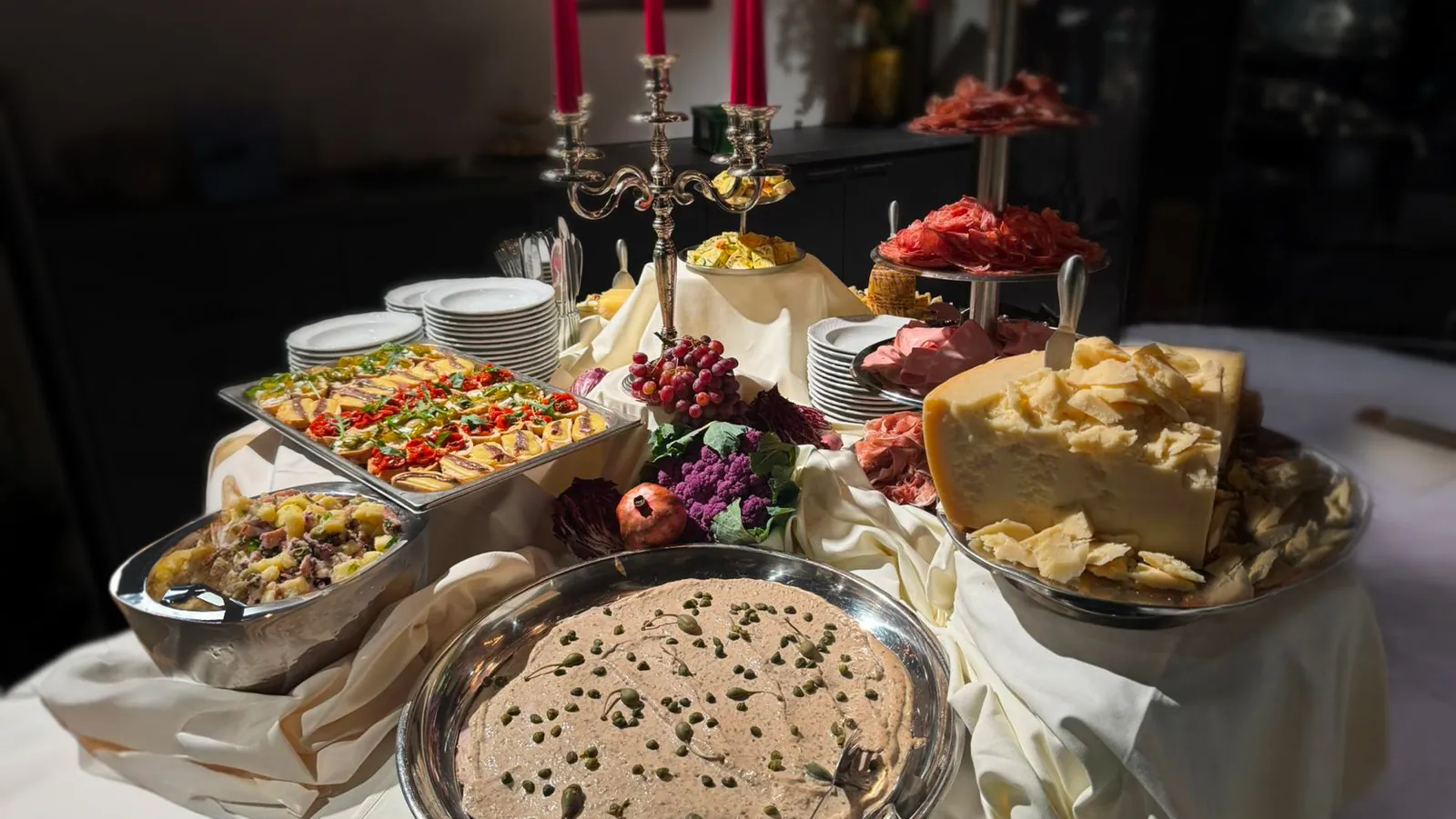 Buffet by candlelight with Parmigiano wheel, House of Catering